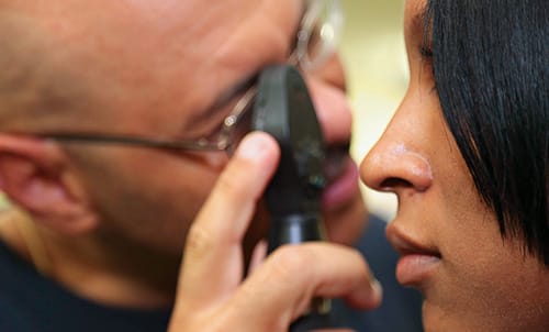 doctor examining eye